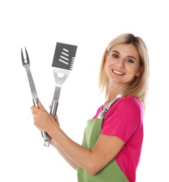 Photo of Woman in apron with barbecue utensils on white background