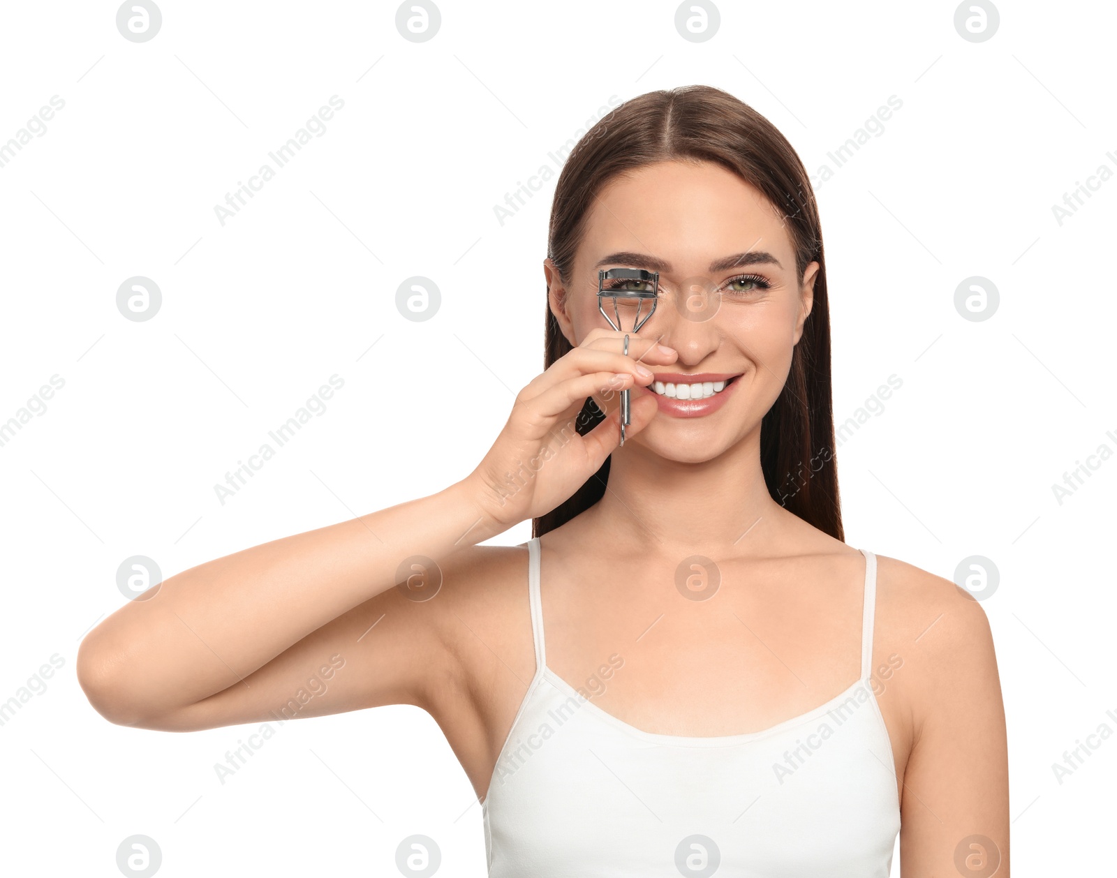 Photo of Woman using eyelash curler on white background
