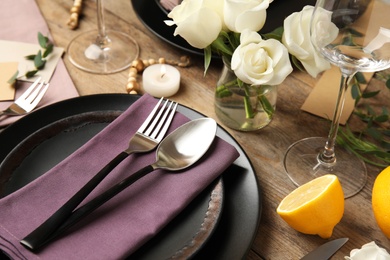 Elegant festive table setting on wooden background