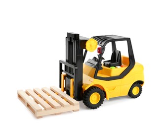 Photo of Toy forklift truck with wooden pallet on white background