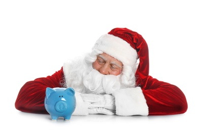 Photo of Santa Claus with piggy bank on white background