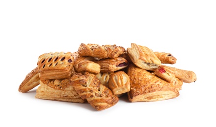 Photo of Heap of fresh tasty puff pastries on white background