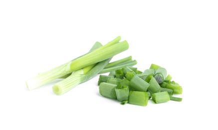 Fresh green spring onions isolated on white