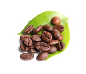 Roasted coffee beans and leaves isolated on white