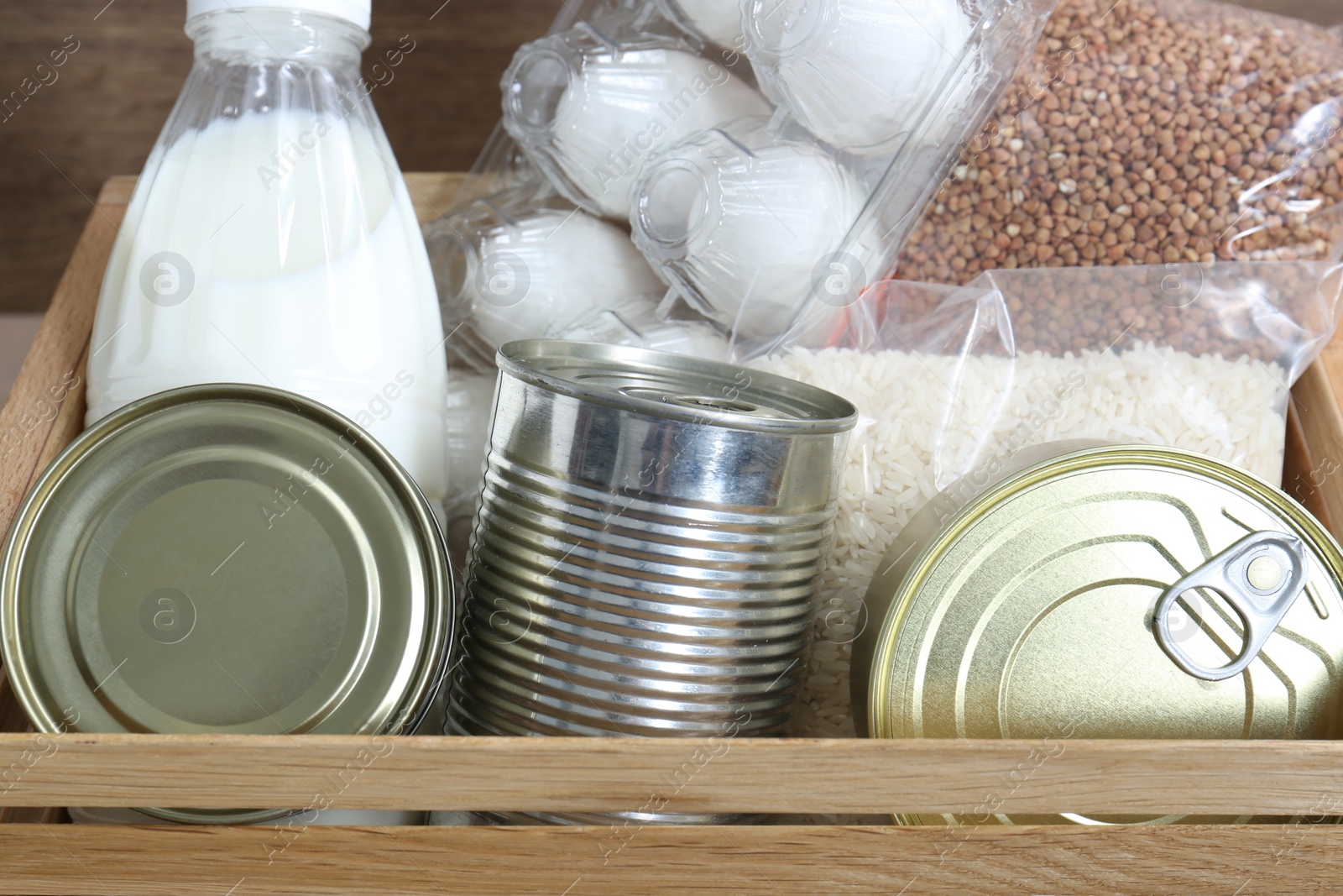 Photo of Donation box with different food products, closeup