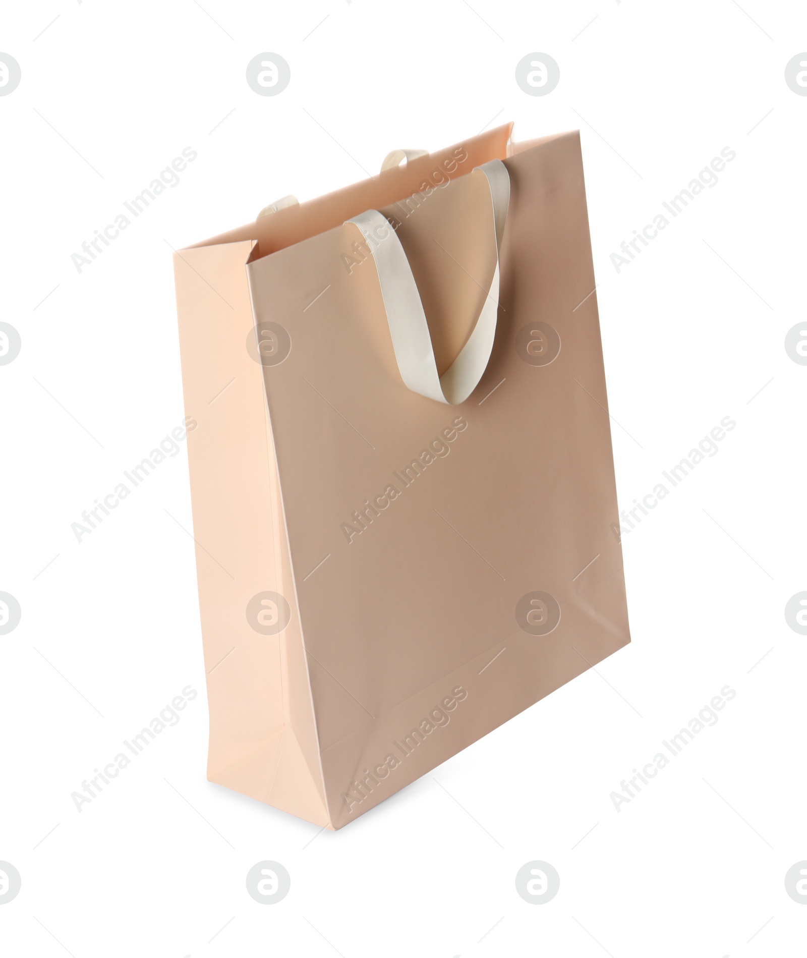 Photo of One beige shopping bag isolated on white