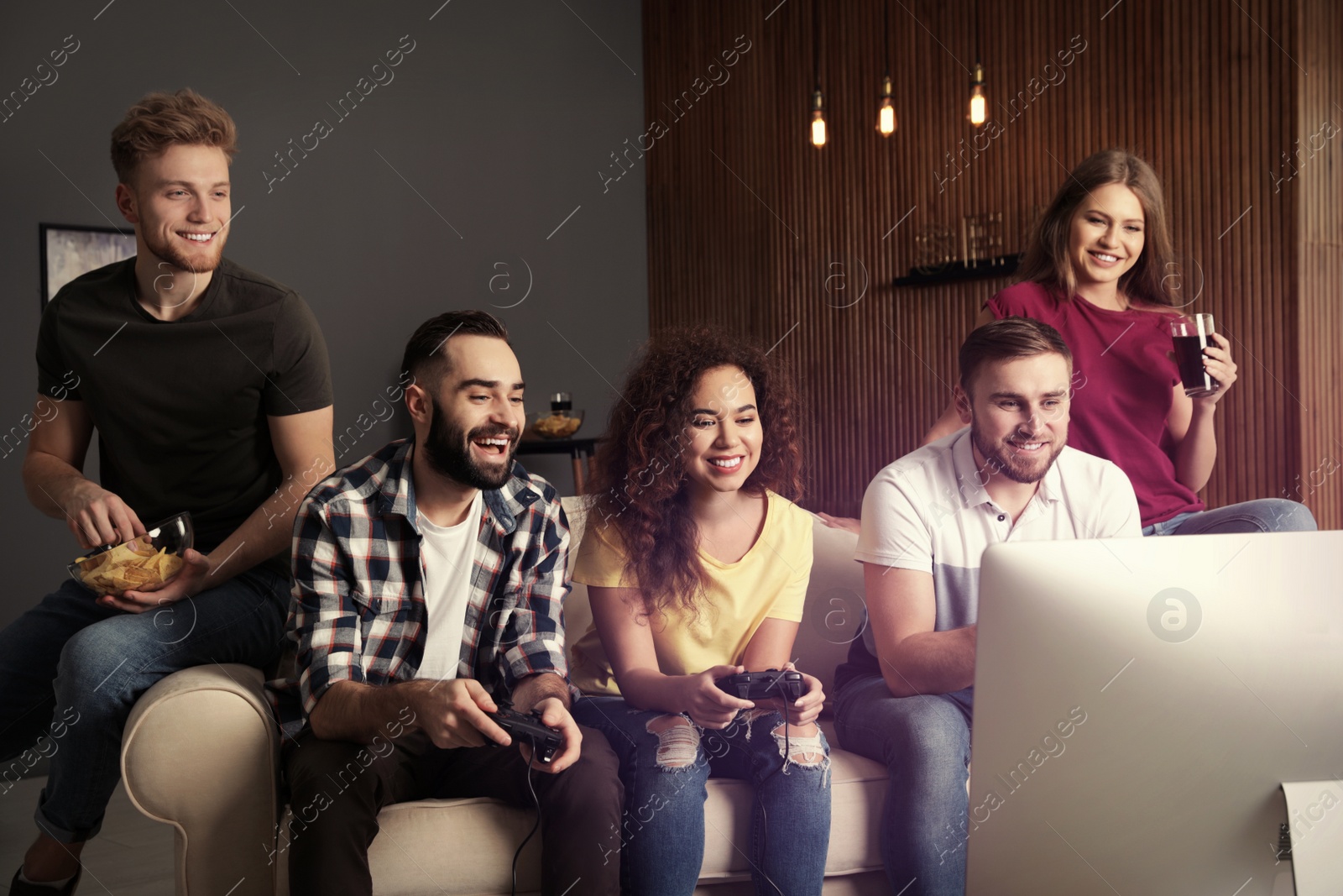 Photo of Emotional friends playing video games at home