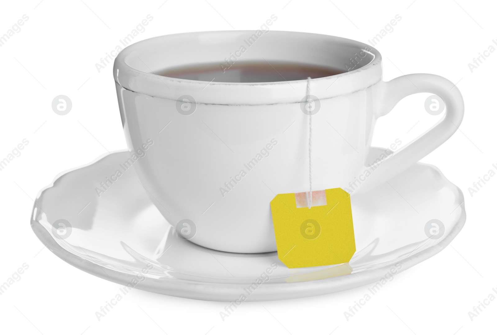 Photo of Ceramic cup with teabag isolated on white