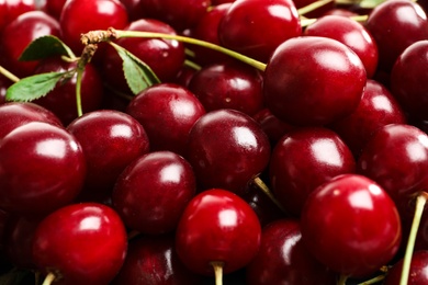 Delicious ripe sweet cherries as background, closeup view