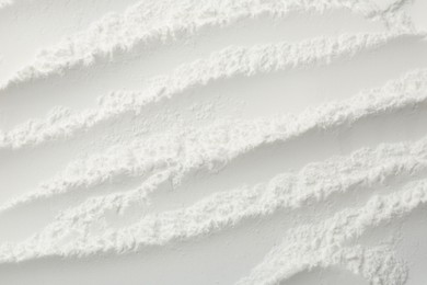 Photo of Texture of baking powder as background, top view