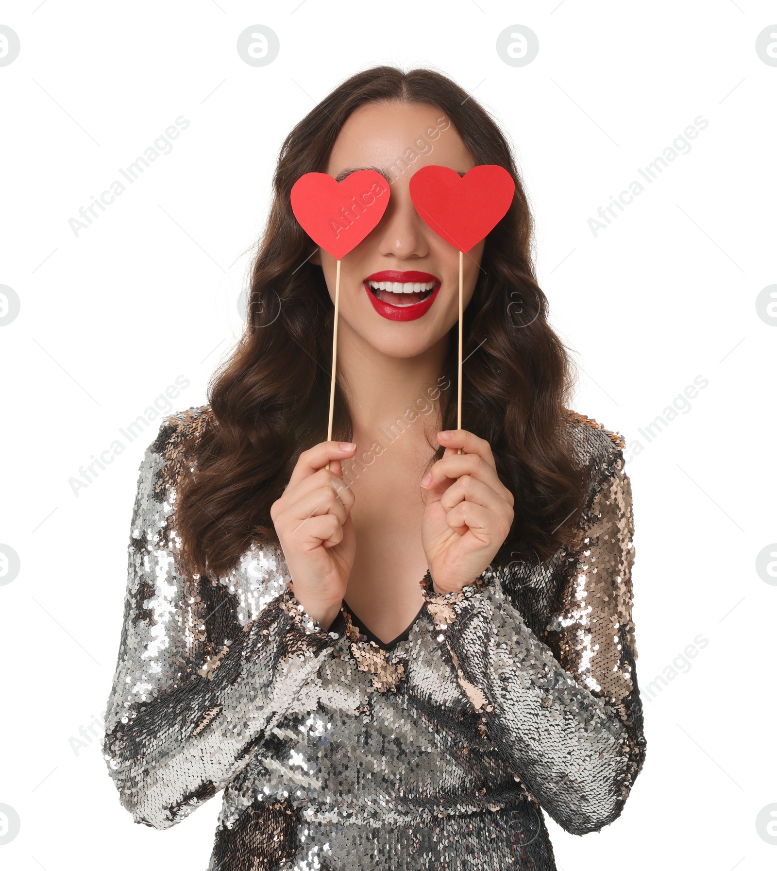 Photo of Young woman covering her eyes with paper hearts isolated on white