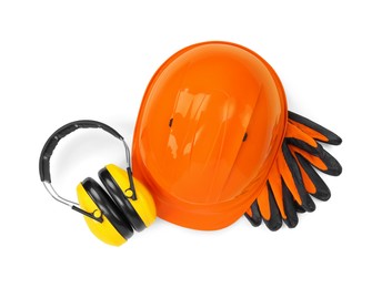 Photo of Hard hat, earmuffs and gloves isolated on white, top view. Safety equipment