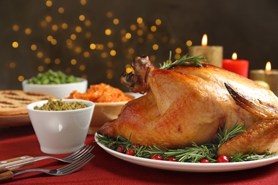 Photo of Delicious roasted turkey served on festive table