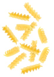 Image of Raw fusilli pasta flying on white background