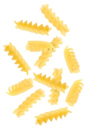 Raw fusilli pasta flying on white background