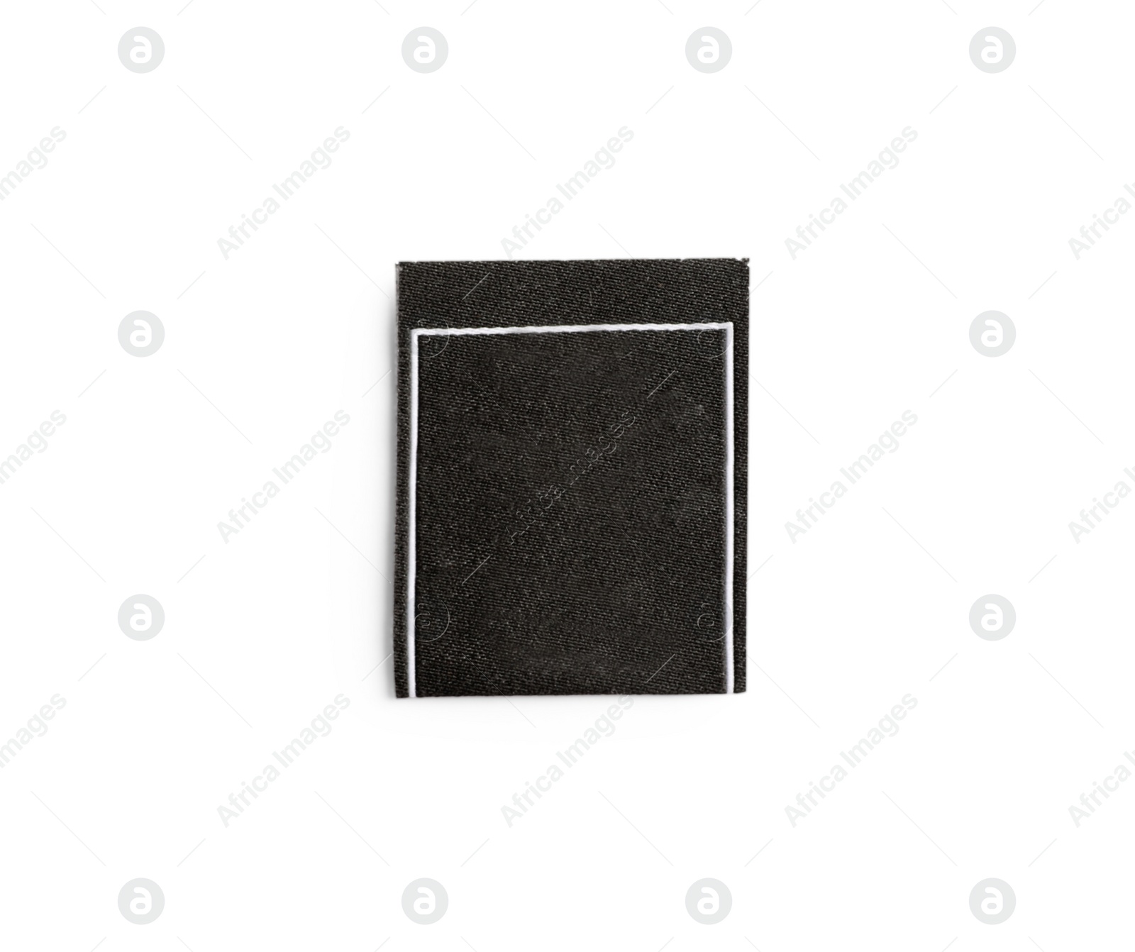 Photo of Blank stylish clothing label isolated on white, top view