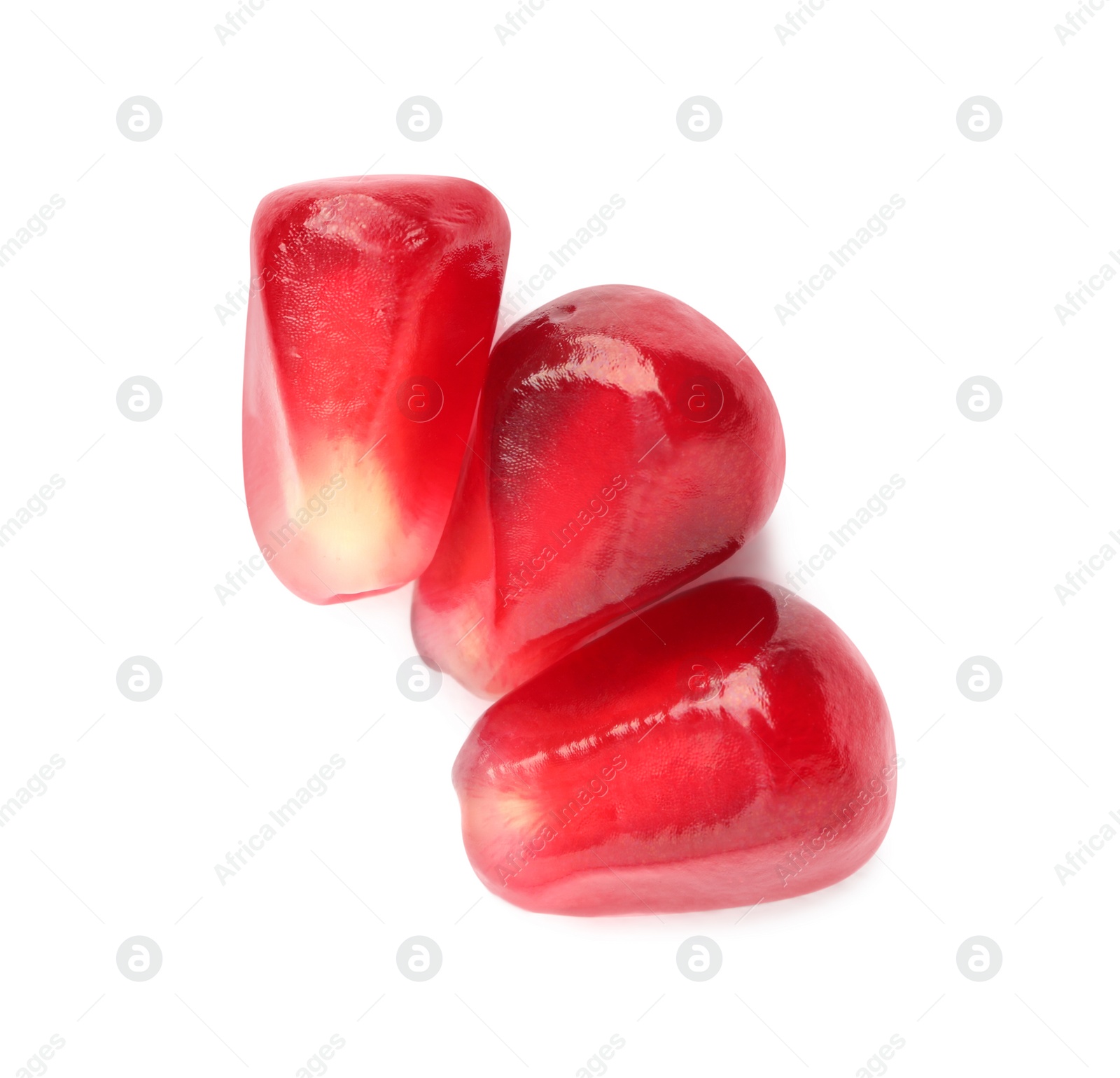 Photo of Tasty pomegranate seeds on white background, top view