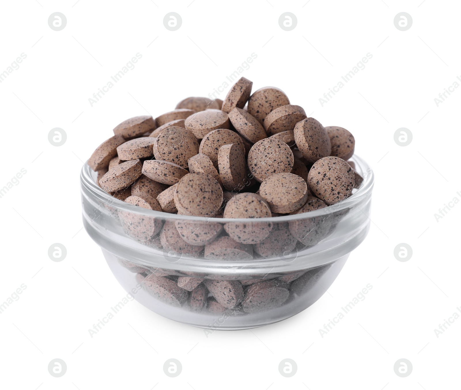Photo of Brewer's yeast tablets in bowl isolated on white