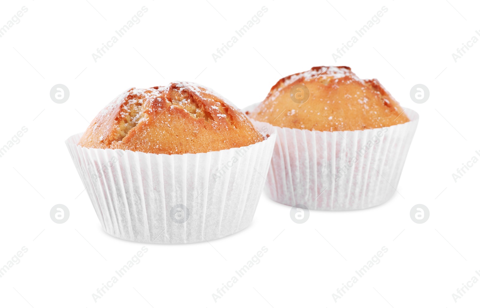 Photo of Tasty muffins powdered with sugar on white background