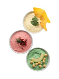 Photo of Different kinds of tasty hummus in bowls on white background, top view