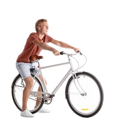 Photo of Handsome young man riding bicycle on white background