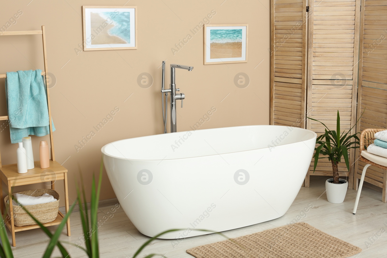 Photo of Stylish bathroom interior with white beautiful tub