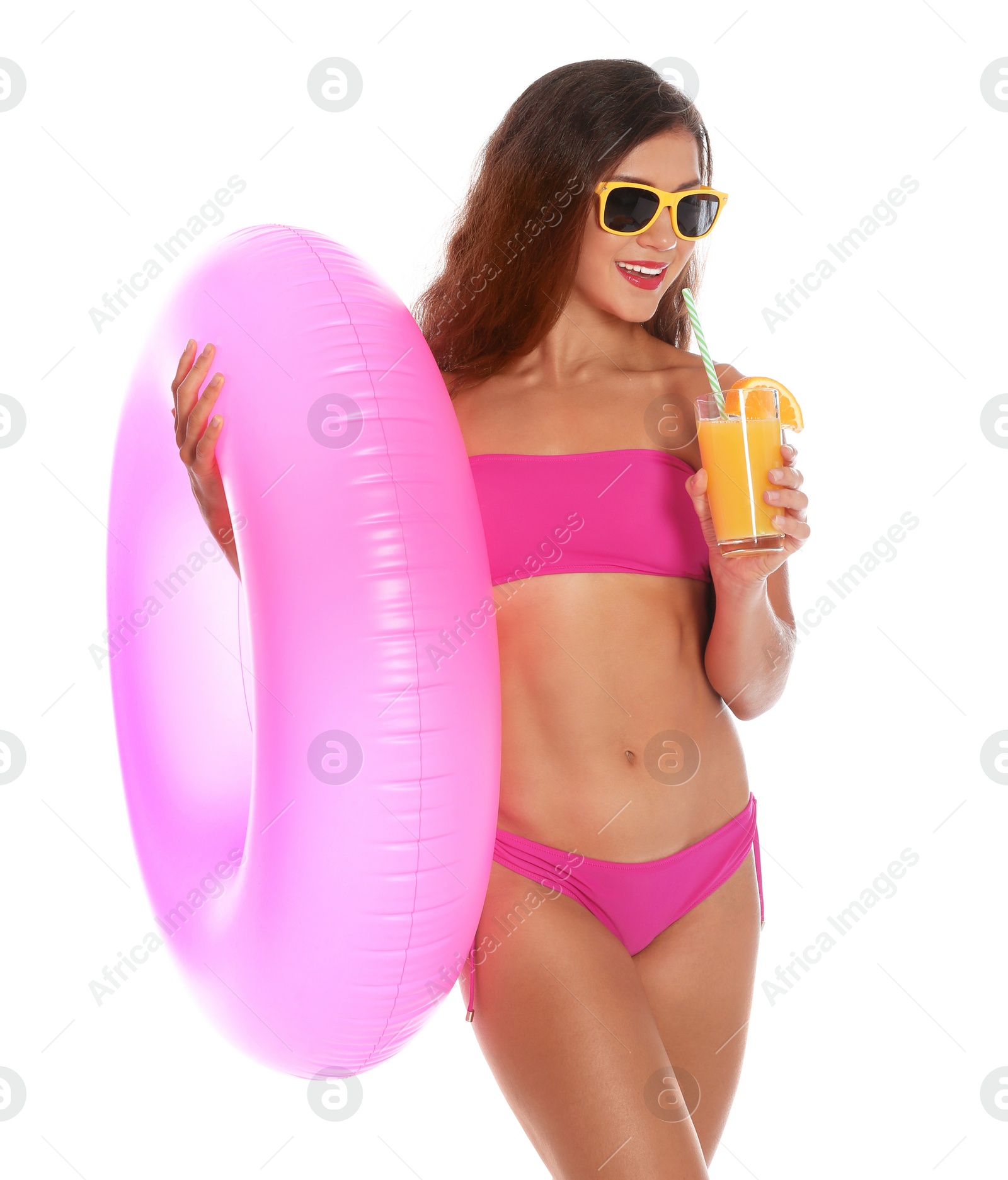 Photo of Beautiful young woman with inflatable ring and glass of cocktail on white background