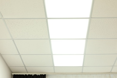 White ceiling with lighting in office room