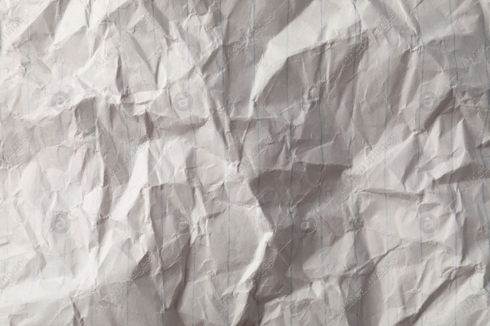 Photo of Crumpled sheet of paper as background, top view