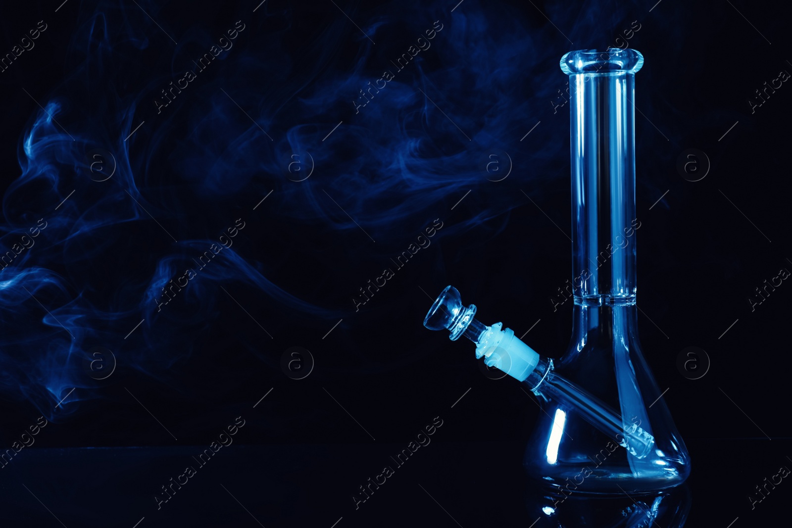 Photo of Glass bong and smoke on black background, space for text. Smoking device
