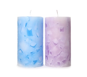 Two color wax candles on white background