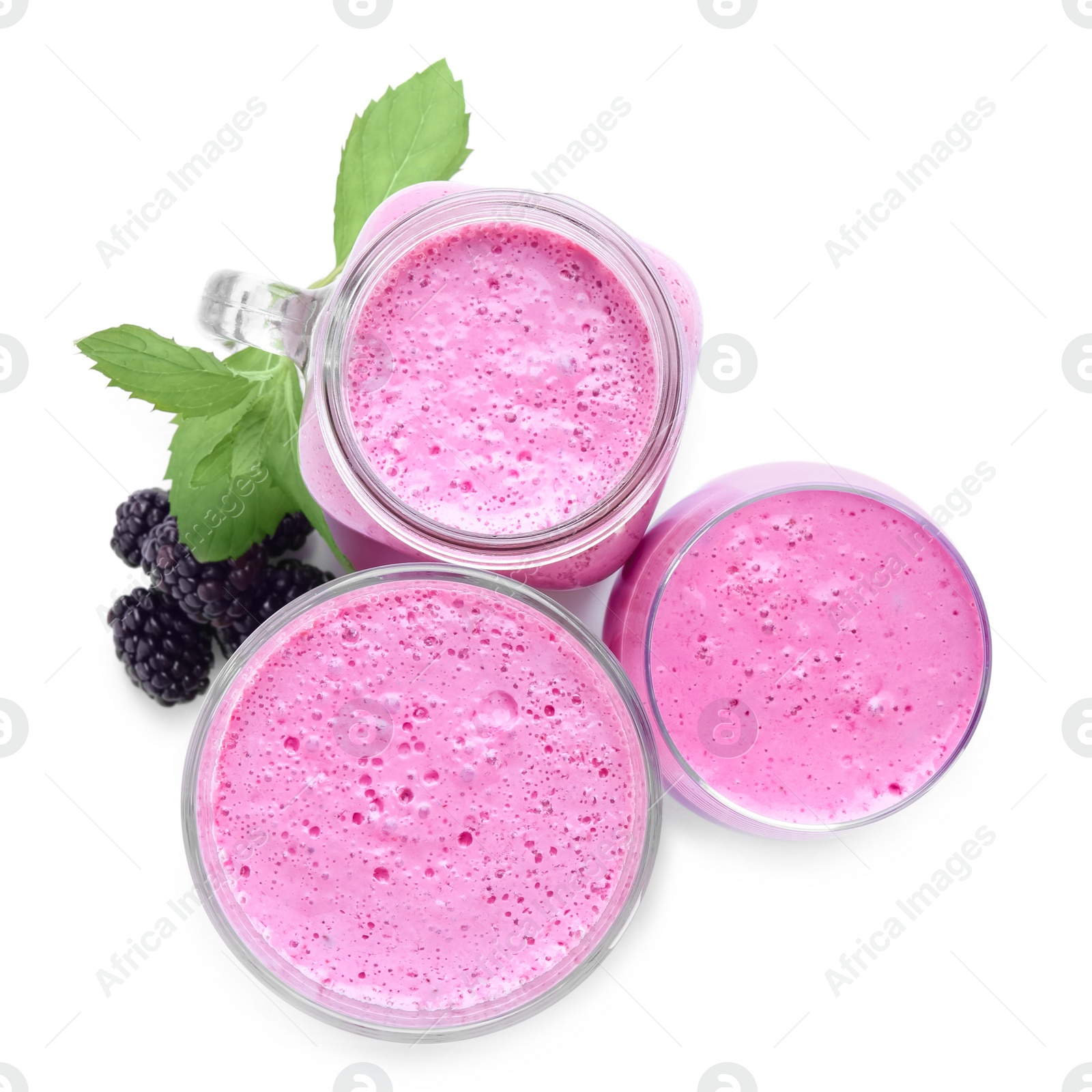 Photo of Delicious blackberry smoothie and berries on white background, top view