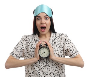 Photo of Emotional overslept woman with alarm clock on white background. Being late concept