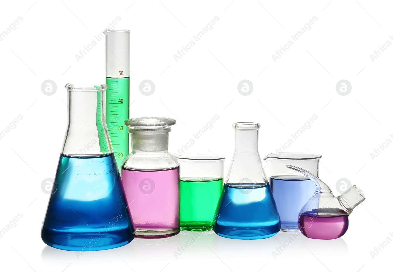 Photo of Laboratory glassware with colorful liquids on white background