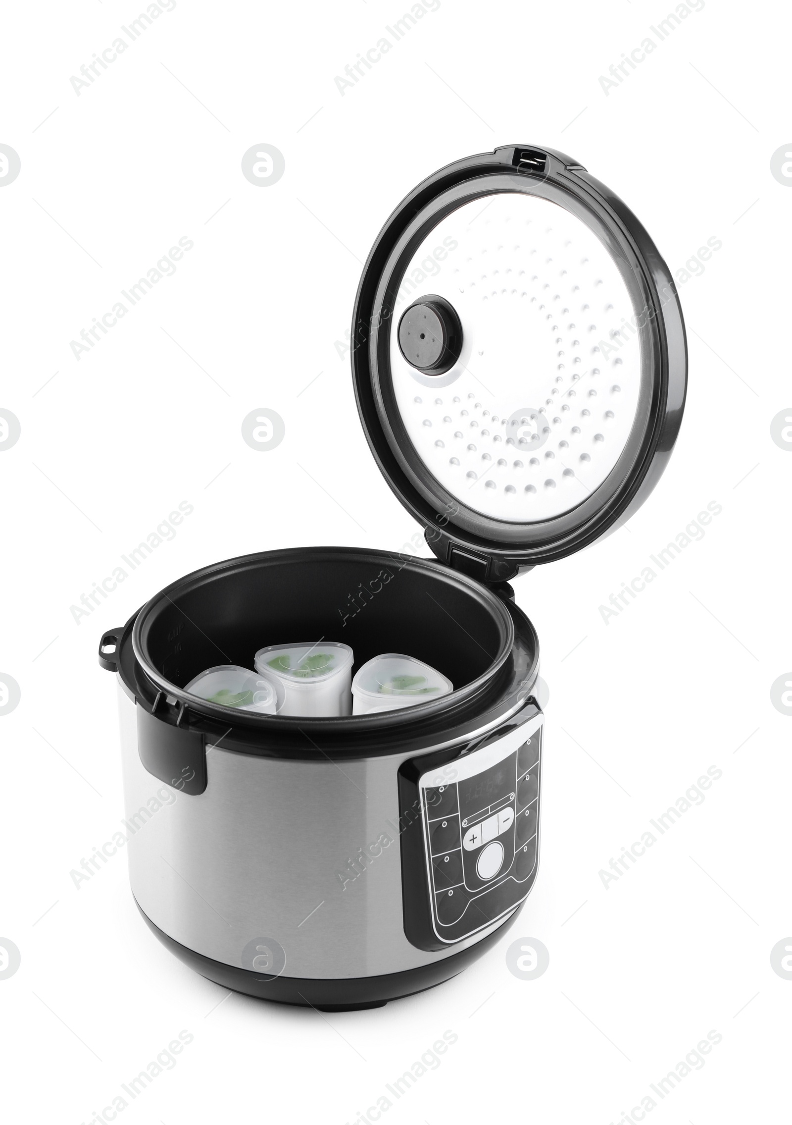 Photo of Open multi cooker with cups of homemade yogurt isolated on white