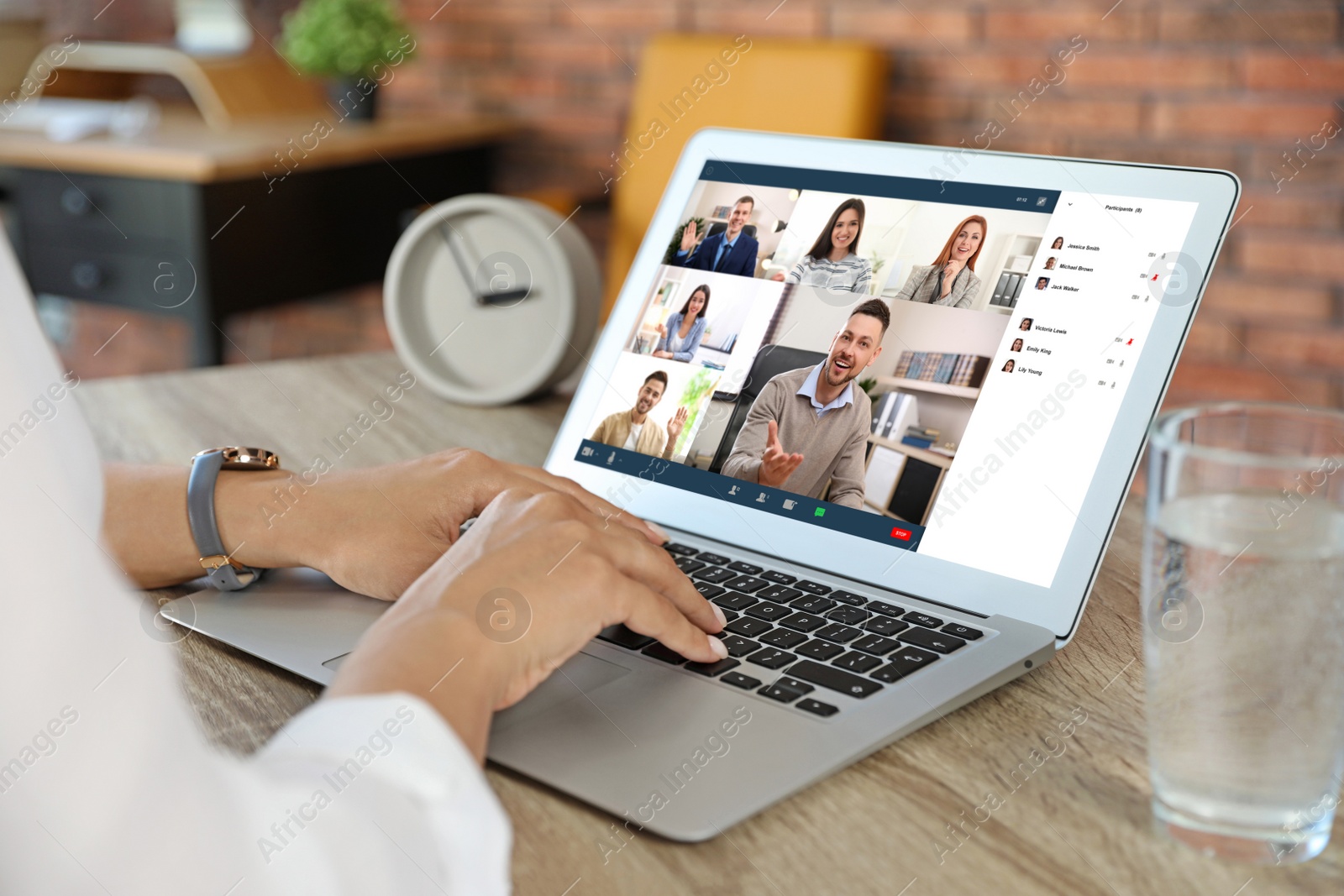 Image of Woman having video chat with team at table, closeup