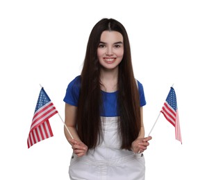 Image of 4th of July - Independence day of America. Happy teenage girl holding national flags of United States on white background
