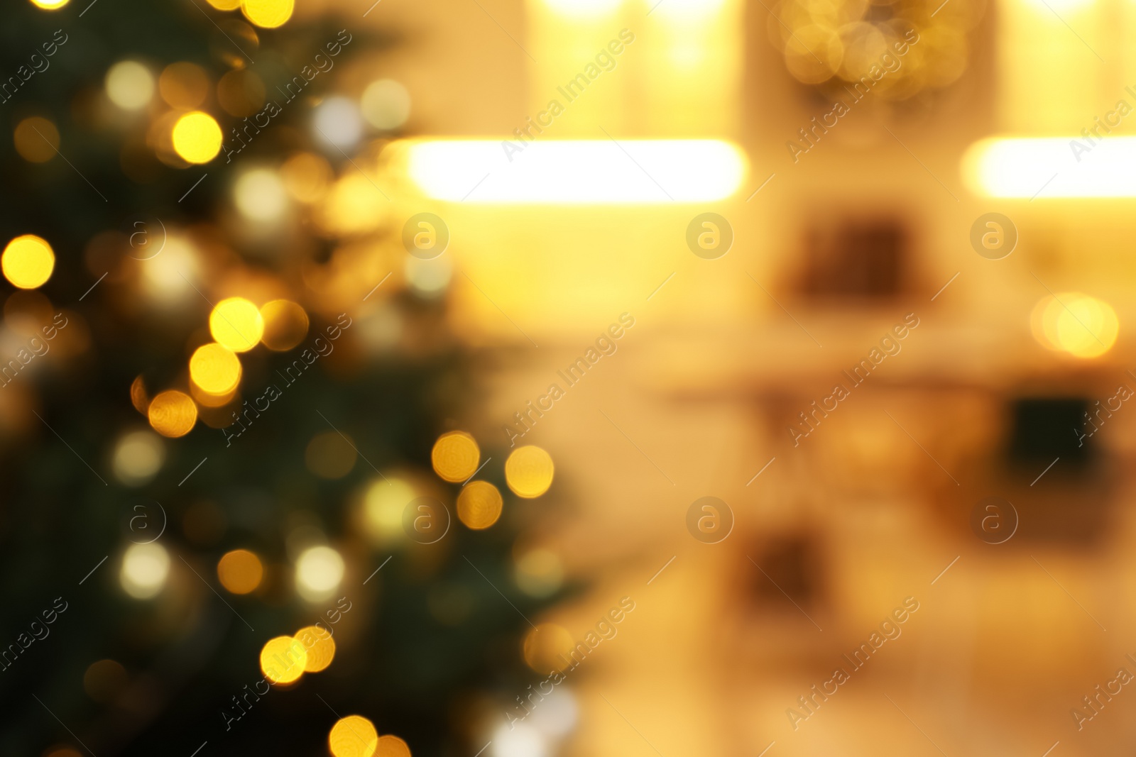 Photo of Blurred view of beautifully decorated Christmas tree indoors