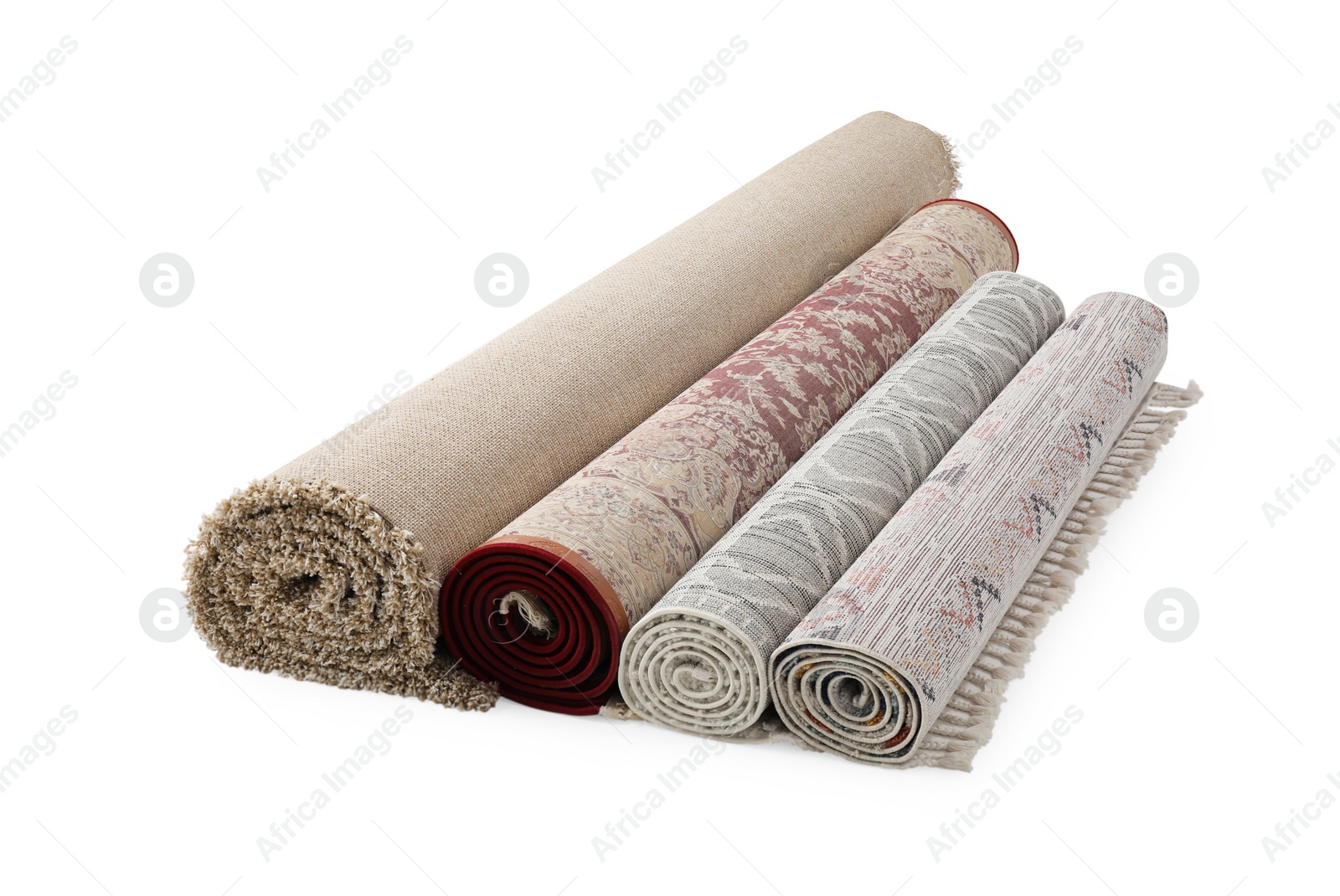 Photo of Rolled carpets on white background. Interior element