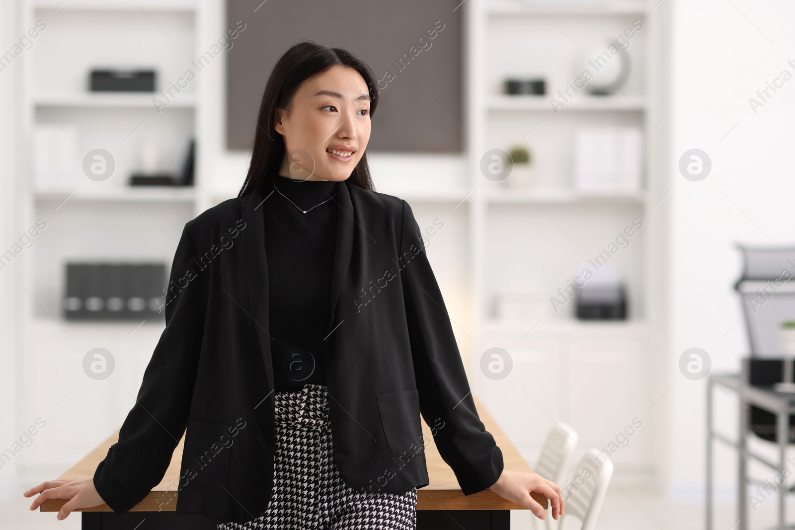 Photo of Portrait of smiling businesswoman in office. Space for text