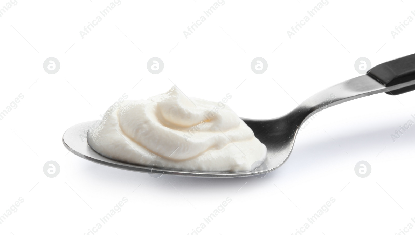 Photo of Metal spoon with sour cream on white background