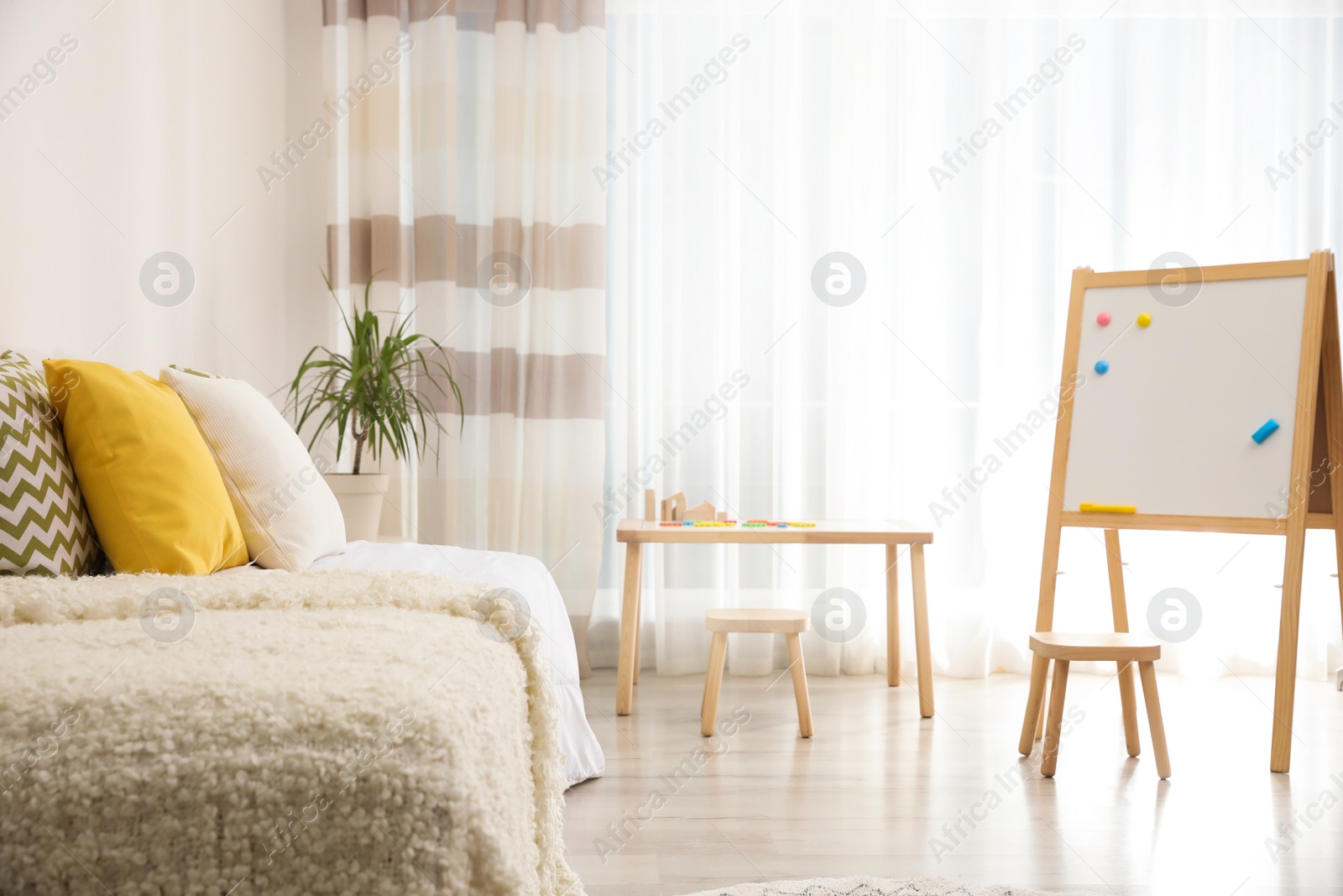 Photo of Modern child room interior with comfortable bed