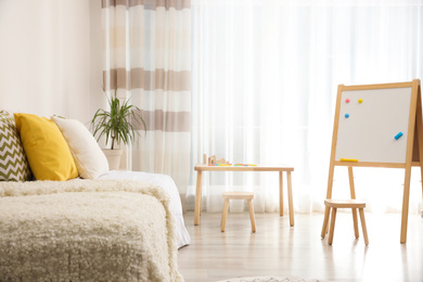 Photo of Modern child room interior with comfortable bed