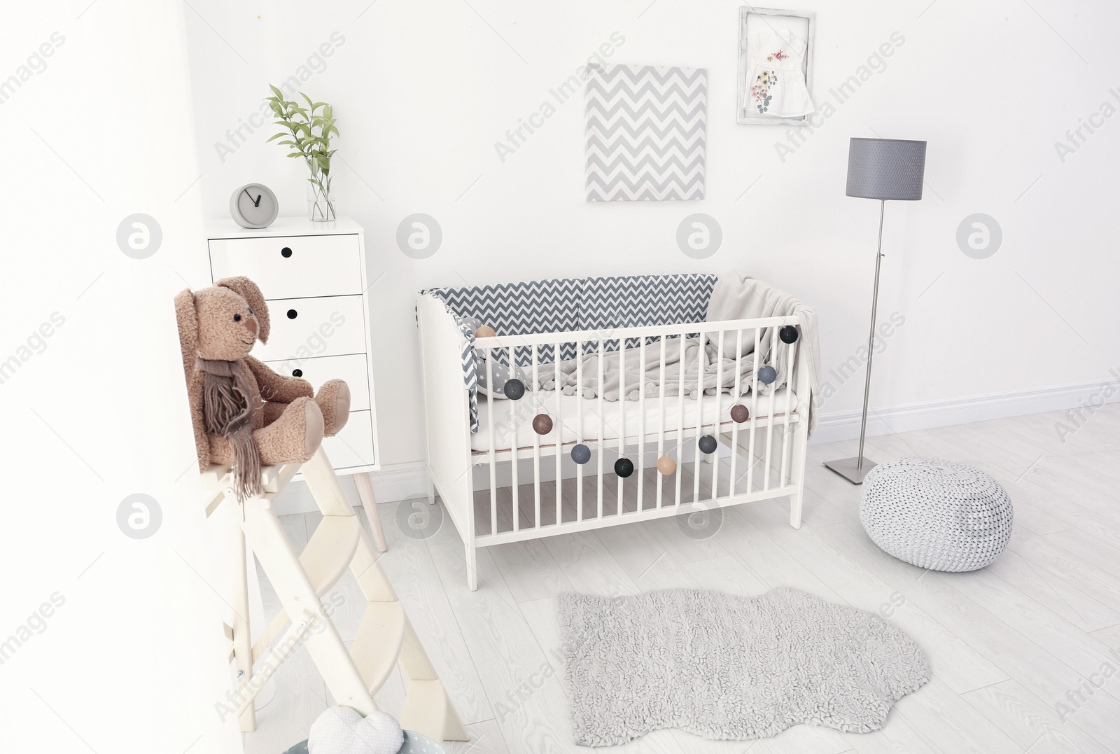 Photo of Baby room interior with comfortable crib