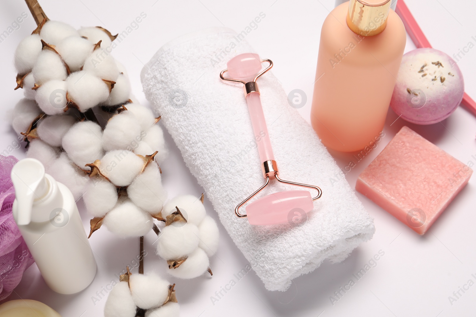 Photo of Bath accessories. Different personal care products and cotton flowers on white background, above view