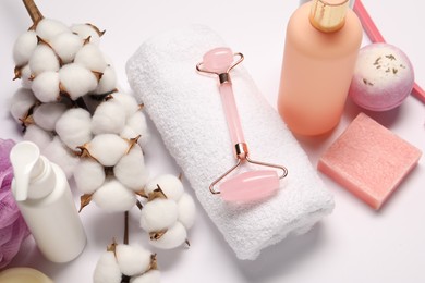 Photo of Bath accessories. Different personal care products and cotton flowers on white background, above view