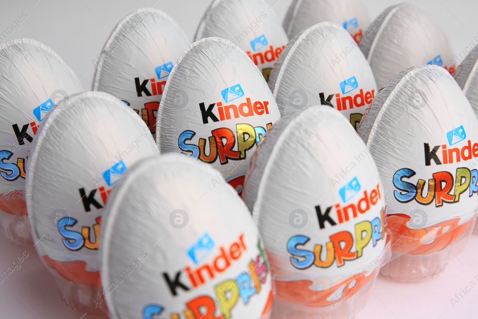 Photo of Sveti Vlas, Bulgaria - June 26, 2023: Kinder Surprise Eggs in plastic tray on white background, closeup