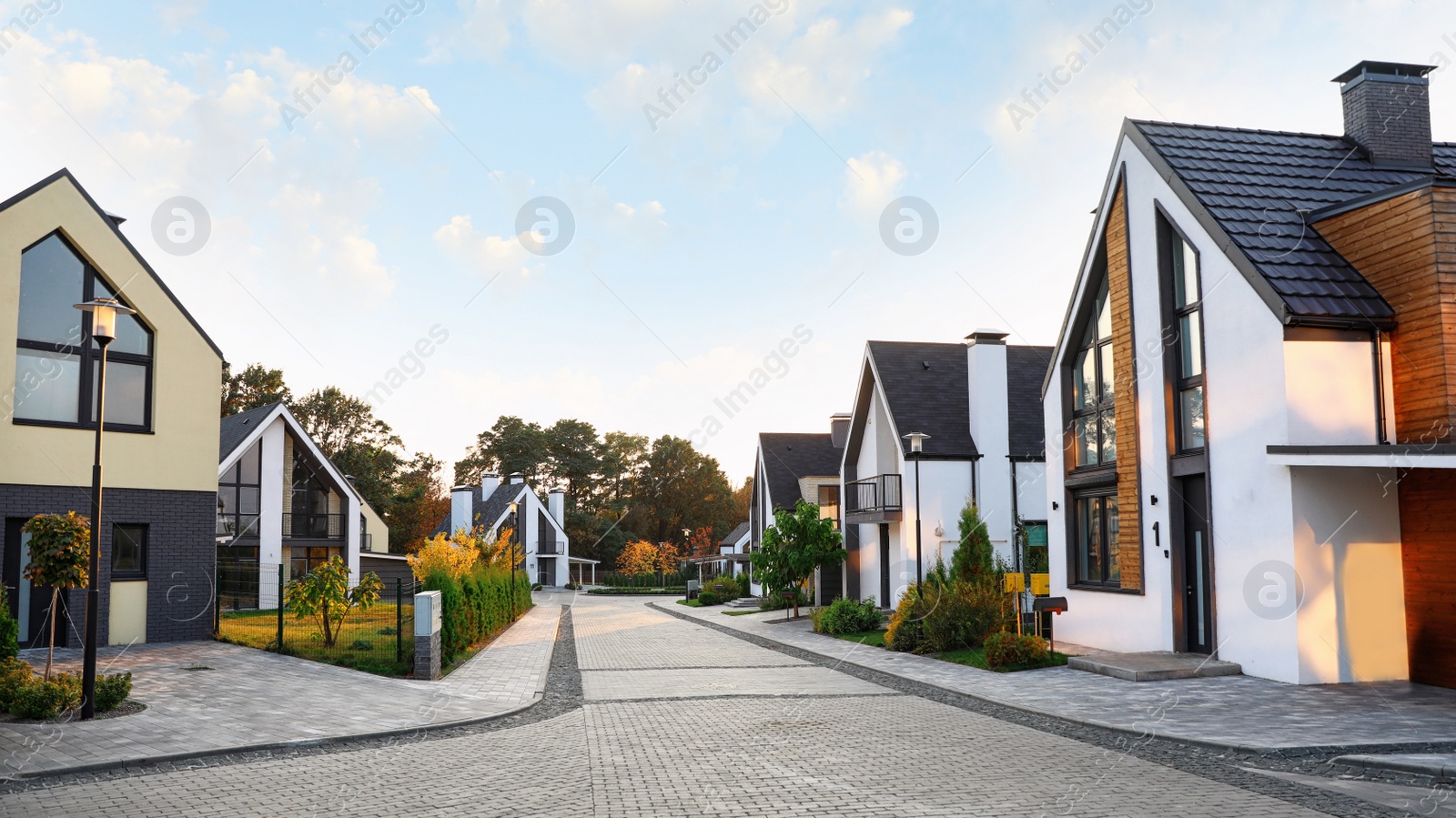 Photo of Modern village with different new houses at sunset