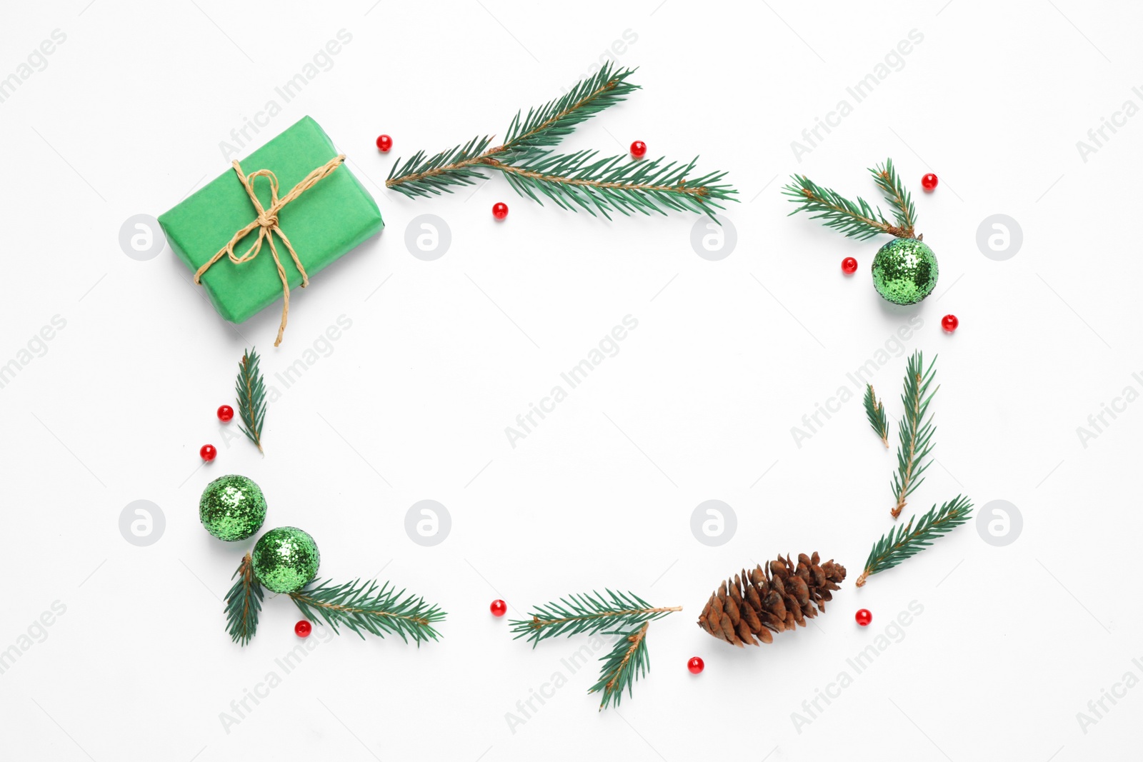 Photo of Flat lay composition with Christmas gift and festive decor on white background. Space for text