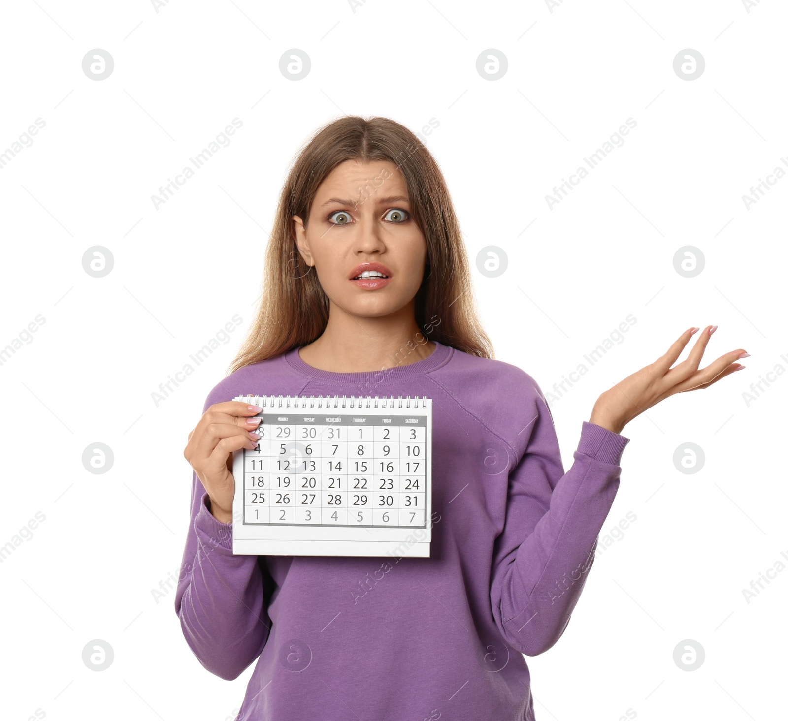 Photo of Emotional young woman holding calendar with marked menstrual cycle days on white background